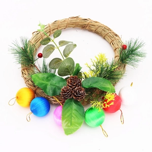Christmas wreath with straw base, pine needles, cones and six colorful silk baubles