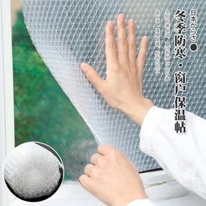 Detail showing the installation of transparent bubble film insulation on a window