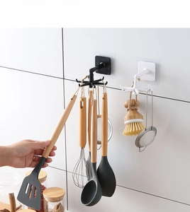 Detail of 360-degree rotating 6-claw kitchen wall hooks showing space-saving storage