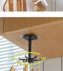 Close-up of 360-degree rotating 6-claw kitchen hook installed under a cabinet