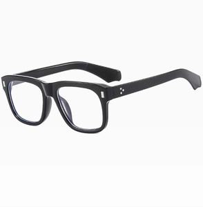 Close-up of black square sunglasses with silver rivets and blue light filter lenses