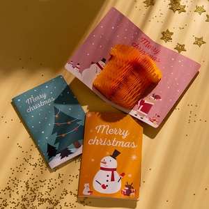 3D Pop-up Christmas cards set with honeycomb design and envelopes on a starry background