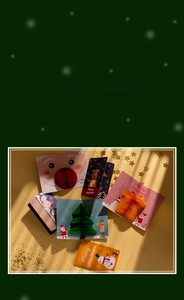 Detailed view of 3D honeycomb Christmas cards featuring Santa, reindeer and tree designs