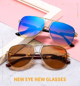 Close-up of metal grid sunglasses with blue-pink and brown gradient aviator lenses