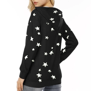 Detail view of the back showing light green star prints on a black hooded sweatshirt