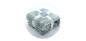 Detail of mint green flannel blanket with white ribbon and RIFFANY gift packaging