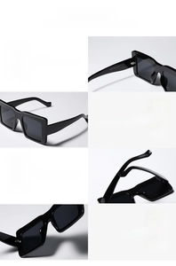 Detail view of black oversized square sunglasses showing reinforced metal hinges and CE marks