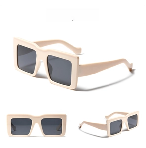 Front and side views of oversized cream square frame sunglasses with dark grey lenses