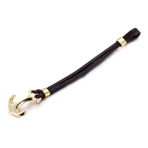 Vintage brown leather multilayer bracelet with golden anchor clasp on white background