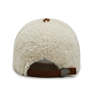 Winter faux shearling baseball cap in cream with brown suede strap and metal buckle