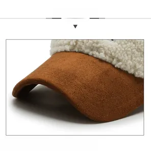 Detail of sherpa baseball cap with a brown faux suede brim and reinforced structure