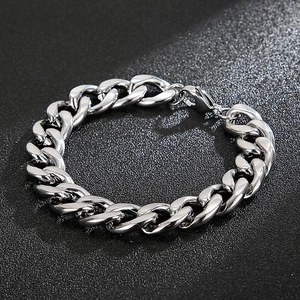 Detailed close-up of a polished silver stainless steel Cuban link bracelet for men