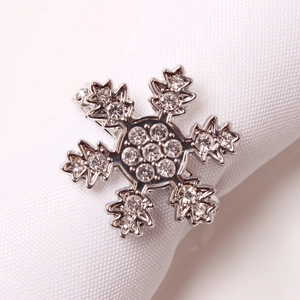 Elegant silver snowflake napkin ring with sparkling rhinestones for festive table setting