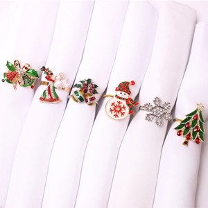 Set of 6 Christmas napkin rings featuring reindeer, snowflakes, and festive trees