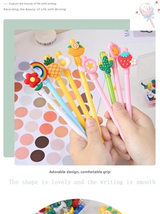 Detailed view of colorful cartoon gel pens featuring 3D silicone fruit and rainbow toppers