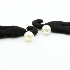 Elegant white pearl hair clip with golden flower detail for buns and updos