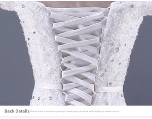 Dettagli dell'abito da sposa bianco in pizzo con allacciatura a corsetto sulla schiena