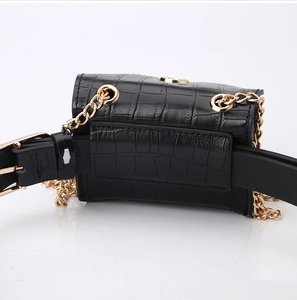 Close-up of black faux crocodile leather waist bag showing the belt loop and gold chain