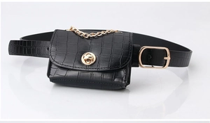 Detail of black croc-embossed waist bag with gold chain and oval pin buckle belt