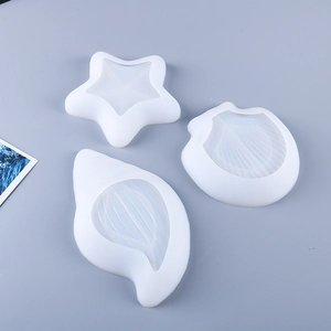 Detailed view of starfish shell and scallop silicone resin casting molds for DIY crafts