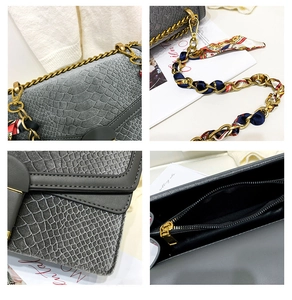 Dettagli della borsa grigio scuro trama coccodrillo con catena a foulard e struttura interna