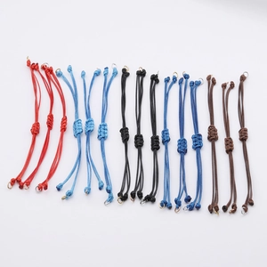 Detailed macro view of adjustable 0.8mm waxed cord bracelets in various vibrant colors