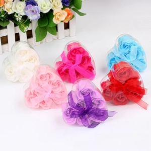 Macro detail of heart-shaped gift boxes with 6-color soap roses and ribbon bows