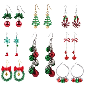 Detailed collection of Christmas earrings featuring festive trees, bells, and snowflakes