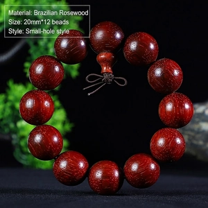 Detailed close-up of 20mm Brazilian Rosewood prayer beads with 12 round beads and fine grain