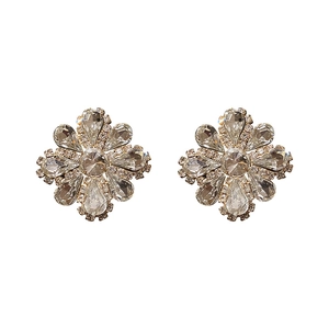 Elegant gold flower stud earrings featuring sparkling clear rhinestones on white backdrop