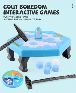 Detailed view of the Penguin Trap ice breaking board game set with hammers and spinner