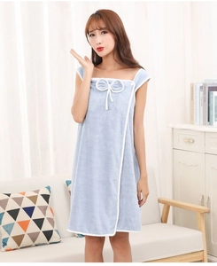 Close-up of light blue wearable towel robe with white lace trim and bow decoration