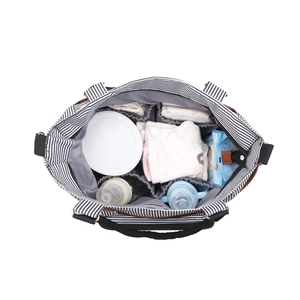 Top view of striped diaper bag showing internal compartments and large storage capacity