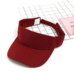 Burgundy summer sun visor hat with adjustable velcro strap and cotton fabric texture