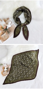 Detail of pleated paisley square scarf in olive green and brown with zigzag edges
