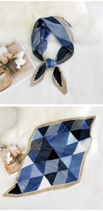 Detail of pleated silk scarf featuring blue and black geometric diamond pattern textures