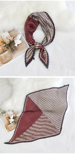 Detail of pleated square silk scarf with burgundy and beige geometric pattern