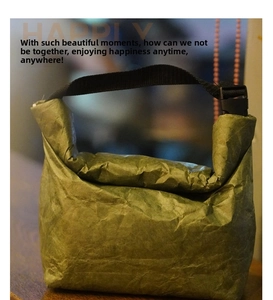 Close-up of vintage green Tyvek lunch bag with waterproof texture and buckle closure
