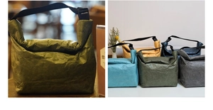 Detail view of colorful Tyvek lunch bags with waterproof texture and durable handles