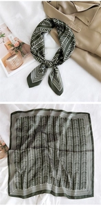 Detail of dark green geometric silk scarf paired with a trench coat and flat lay view