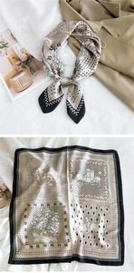 Detail of vintage square silk scarf featuring classic carriage patterns and paisley motifs
