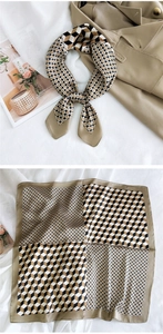 Detailed view of square silk scarf with geometric cube pattern and polka dot print