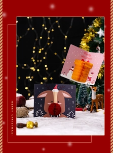 Detail of 3D pop-up Christmas cards featuring honeycomb snowman and reindeer designs