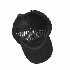 Detail of winter baseball cap showing corduroy brim, fleece exterior and mesh lining