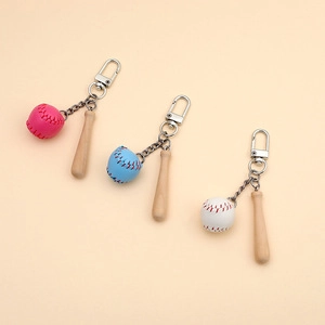 Three-piece baseball keychain set featuring mini wooden bats and colorful balls