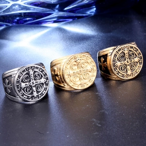Three St. Benedict religious cross rings in silver, gold, and black punk vintage styles