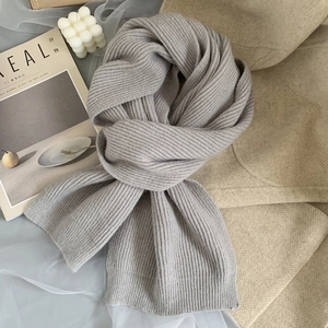 Soft grey ribbed knit winter scarf for women in a minimalist Korean style layout