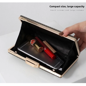 Macro view of a geometric evening clutch interior with enough space for a phone and lipstick
