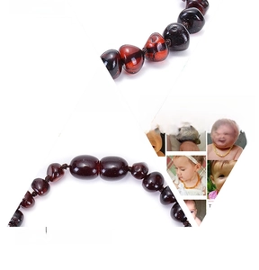 Detailed macro view of smooth cognac Baltic amber beads on a durable baby bracelet
