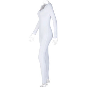 Close-up of white slim fit long sleeve jumpsuit showing elastic fabric and side contour